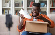© Prostock-studio - Social media influencer stylish cheerful chubby black guy reviewing product. Excited african american millennial man vlogging about unpacking white sneakers and filming himself at home on cell phone