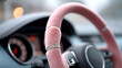© Ruzana - Elegant pink fuzzy steering wheel cover with rhinestone accents in car interior
