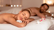 © Prostock-studio - Relaxed Spouses Enjoying Aromatherapy Lying And Relaxing In Luxury Spa Center, With Eyes Closed. Wellness And Relaxation, Body Care Concept. Low Light, Selective Focus, Panorama