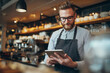 © mattegg - Barista using tablet in cafe