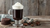 A glass Irish coffee mug with whipped cream and dark coffee.