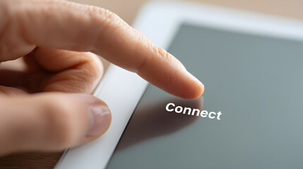 A finger touches the screen on a tablet, about to press the 