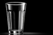 © ChaoticMind - Clear glass tumbler isolated on a dark background highlighting its shape and design
