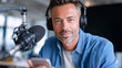 © Karen - Confident man podcasting with microphone headset