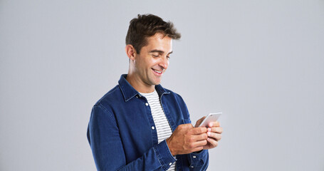 Aufkleber - Smile, mobile and man in studio for typing, text or reading message on white background. Phone, happy person and check email online on app for forum post, play game or social media with mockup space