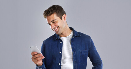 Aufkleber - Smile, phone and man in studio for social media, text or reading message on white background space. Mobile, happy person and check email online on app for communication, news or blog post on internet