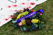 © Austockphoto - ANZAC day lest we forget wreath waiting on grass ready to be laid at memorial service