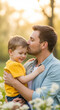 © Cliff - Dad kisses his little son and holds him in his arms. Father's Day, family values