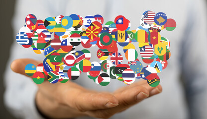 Aufkleber - Diverse flags in a person's hand, symbolizing international collaboration and global unity.