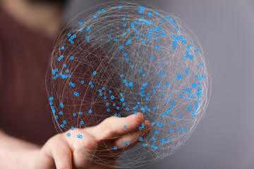 Aufkleber - Abstract image of a hand holding a global network.  Concept for technology, connection, and communication.