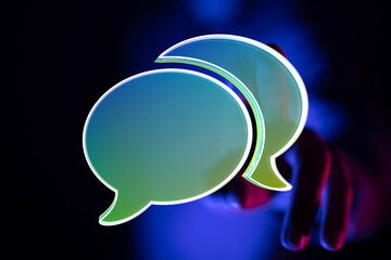 Poster - Abstract image of two glowing speech bubbles, representing online communication and conversation.