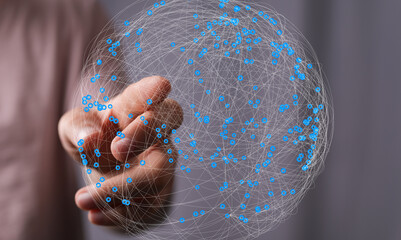 Aufkleber - Abstract image of a hand interacting with a digital network sphere, representing global connectivity and data.