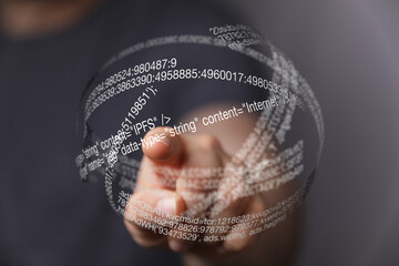 Fototapete - Hand pointing at a futuristic digital sphere of code.  Technology, innovation concept.