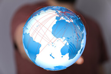 Fototapete - High-quality image of a person holding a digital globe, illustrating global connectivity and networking.