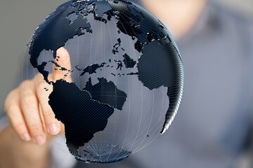 Poster - Abstract image of a hand interacting with a digital 3D model of planet Earth, representing global connectivity and networking.