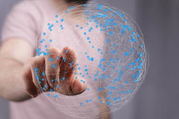 Aufkleber - Person touching a digital globe, illustrating global connectivity and networking.