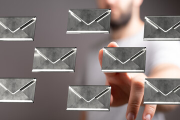 Poster - Abstract image of a man interacting with floating email icons.  Concept for digital communication, inbox, messaging.