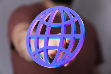 Aufkleber - Hand reaching for a vibrant 3D globe, symbolizing global connection and networking.