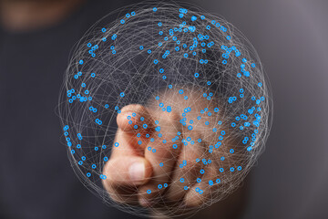 Leinwandbilder - Hand interacting with a digital sphere, illustrating global network and connection.