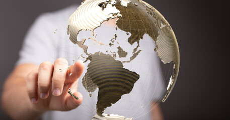 Fototapete - A hand interacts with a digital globe, symbolizing global connectivity and networking.