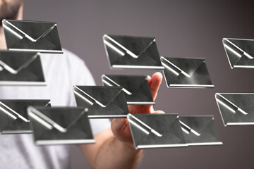 Poster - A person interacts with floating email icons, symbolizing email management and communication.