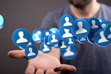 Fototapete - Abstract image of a man's hand holding a network of digital profile icons, representing social media, connections, or networking.