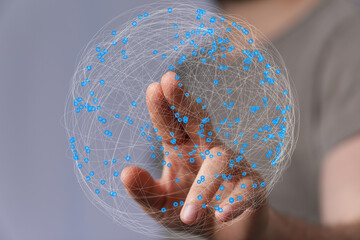 Fototapete - Abstract image of a hand interacting with a digital sphere representing global network connections.