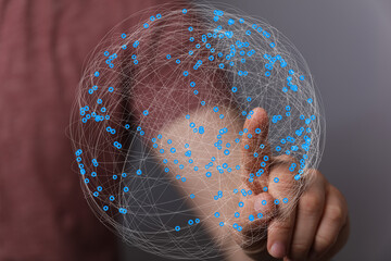 Aufkleber - Abstract image of a hand interacting with a digital globe, representing global networking and connection.