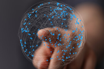 Fototapete - Abstract image of a hand interacting with a digital globe, representing global networking and connection.