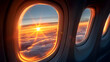© Earny - Breathtaking sunrise view from an airplane window above the clouds, showcasing vibrant colors and serenity.