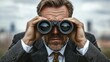 © ROY - Focused man in suit, using binoculars