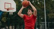 © Vyatcheslav - Young man shooting basketball in outdoor court during daytime