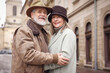 © New Africa - Happy senior couple on city street. Space for text