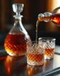 © miss irine - Whiskey is poured from bottle into glass. Amber liquid, classic drink. Elegant decanter, crystal glasses on table. Alcohol beverage photo for bar, pub or restaurant. Drink for party, event or holiday.