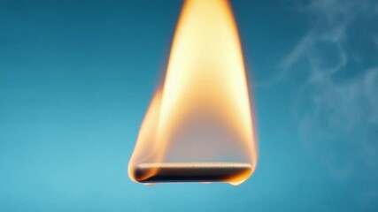 Aufkleber - Burning Flame Dance: Ethereal wisps of smoke curl from a robust flame, a captivating dance of energy against a serene blue canvas.