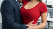 © Cliff - Cropped view of businessman hugging sexy secretary with big breasts in office