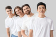 © Pixel-Shot - Group of young men in white t-shirts on light background