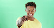 © Emil L/peopleimages.com - Happy, portrait or black man pointing to you on green background for choice in studio. Male person, model or smile with selection, choose or gesture for pick, decision or opportunity on mockup space