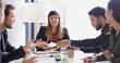 © BuyoutReese10/peopleimages.com - Collaboration, meeting and memo with business people in boardroom of discussion or planning. Corporate, passing notes and teamwork with employee group in office together for professional workshop