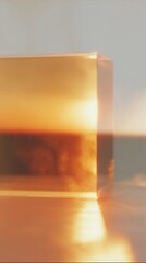 Poster - Transparent amber resin cube with warm glow on reflective surface showcasing modern minimalism and premium design aesthetics for luxury branding