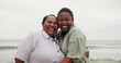 © peopleimages.com - Portrait, mother and daughter with hug on beach for travel, sea holiday and getaway. African family, laughing and embrace with mature woman, ocean vacation and bonding together on trip in nature