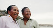 © peopleimages.com - Smile, mature mother and daughter on beach for travel, holiday view and getaway. Women, African family and laughing with love for ocean trip, vacation journey and bonding together for weekend break