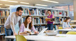 © JackF - Two friendly young adult male and female students preparing for exam together in university library, using textbooks and laptop
