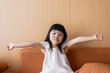 © mei - A sleepy Chinese girl on the sofa