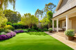 © maribom - Cassic backyard with idullic lawnand house at sunny day