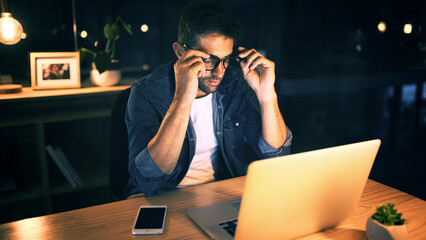 Leinwandbilder - Laptop, tired and man in office at night with burnout for creative project with glasses. Deadline, fatigue and male magazine editor with computer for article publishing with exhaustion in workplace.