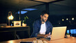 © peopleimages.com - Office, night and businessman with laptop for editing, proofreading and website for news article. Late, male person and journalist with digital for blog deadline, typing story and online publication