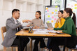 © SOMKID - Group of business people working together with dashboard analysis and data management in conference room, Corporate business and dashboard to presentation concept.