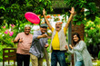 © StockImageFactory - Elderly Indian friends playing frisbee and having fun during outdoor garden meetup