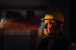 © Ljustina - Senior construction worker wearing hardhat contemplating project progress